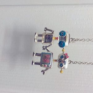 robots holding hand necklace